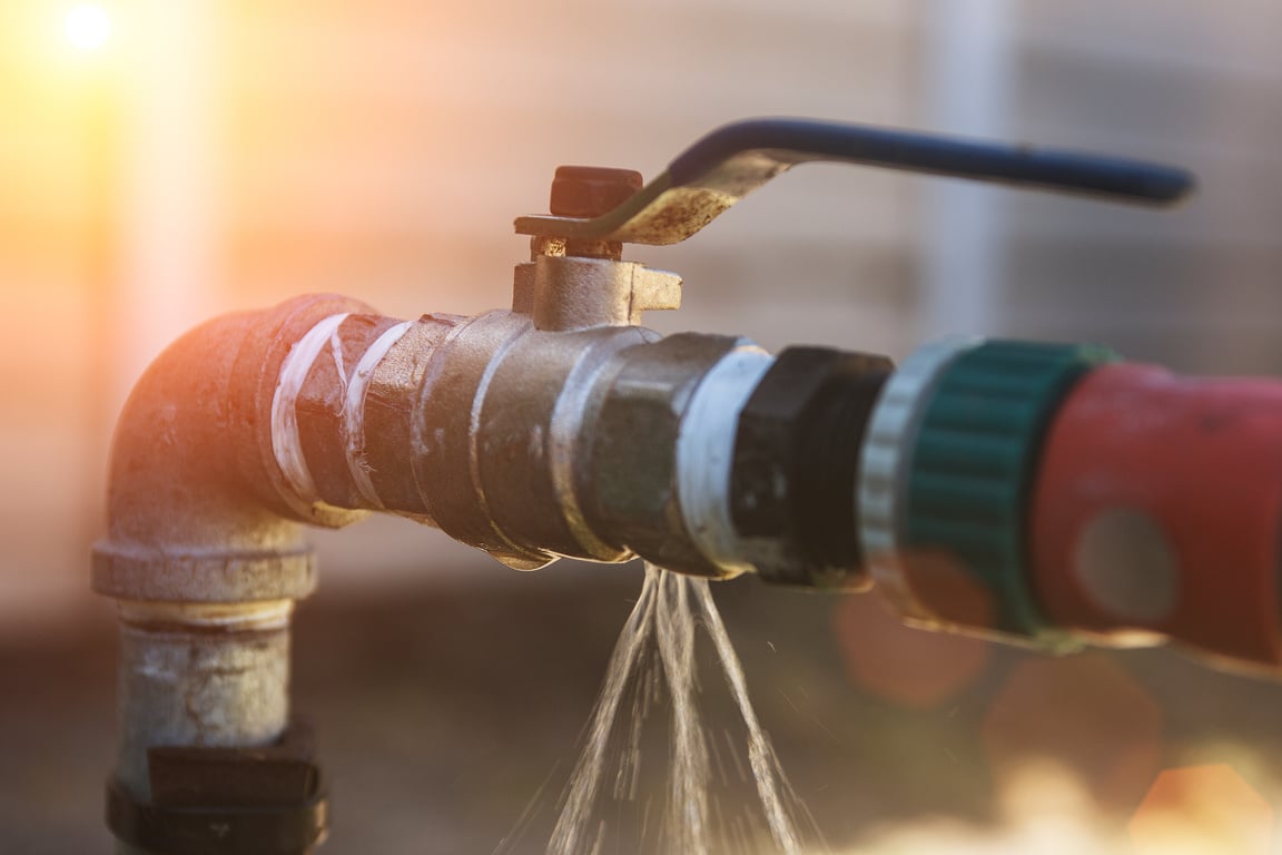 Water leaking from a irrigation pipe faucet